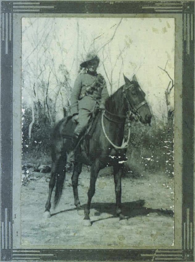 Frank Arnott mounted on horse.